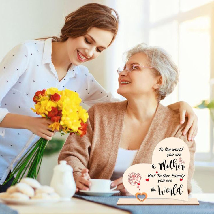 The handmade heart wooden plaque printed with some meaningful words “TO THE WORLD YOU ARE A mother BUT TO OUR FAMILY YOU ARE THE world”. It can make you mum know how important she is to you.