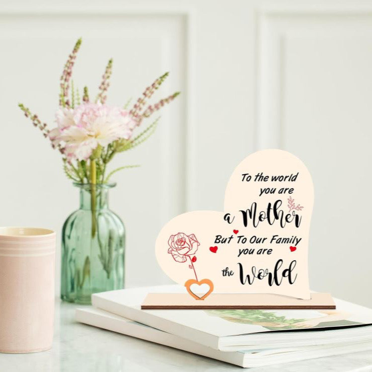 The handmade heart wooden plaque printed with some meaningful words “TO THE WORLD YOU ARE A mother BUT TO OUR FAMILY YOU ARE THE world”. It can make you mum know how important she is to you.